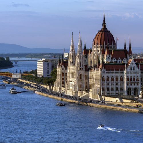 Late afternoon sunlight on the Hungarian Parliament Building in Budapest, Hungary. It is the seat of the National Assembly of Hungary. It lies in Lajos Kossuth Square, on the bank of the River Danube. It is currently the largest building in Hungary and is still the tallest building in Budapest.