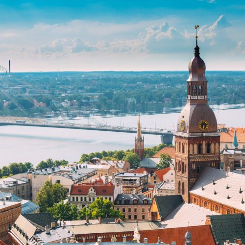Riga, Latvia. Riga Cityscape In Sunny Summer Day. Famous Landmark - Riga Dome Cathedral