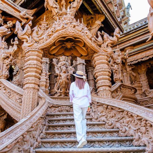 Asian Thai women visit The Sanctuary of Truth wooden temple in Pattaya Thailand